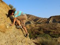 Andrew is climbing the sharp badlands formations at Tabernas. He got a cut on his belly doing this.