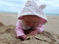 Anastasia was enjoying the Lake Michigan sand for the first time in her life.