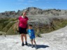 Mother and child (and child) on the crumbling badlands.