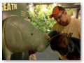 Andrew is trying to smell manatee breath. (For real. It was scratch & sniff.)
