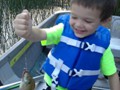 Andrew's first fish, a pumpkinseed, is about his size.