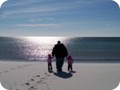 Israel and girls on the white sand beach of Santa Rosa Island, Pensacola Beach, FL.
