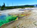 Colors and mist emit from deep within the volcanic core of Yellowstone.