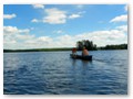 Micah leads a voyage to the small island in Plum Lake.