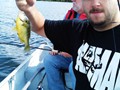 Michael showing off a fish in Plum Lake.